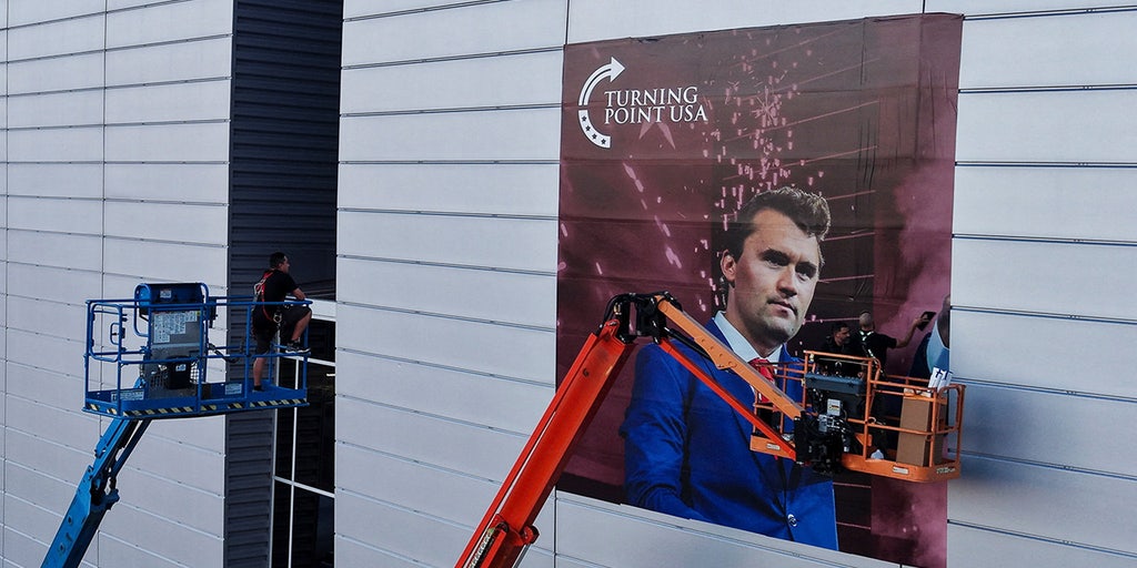 Man detained at Kirk memorial site was allegedly found with gun, knife and expired credentials inside stadium